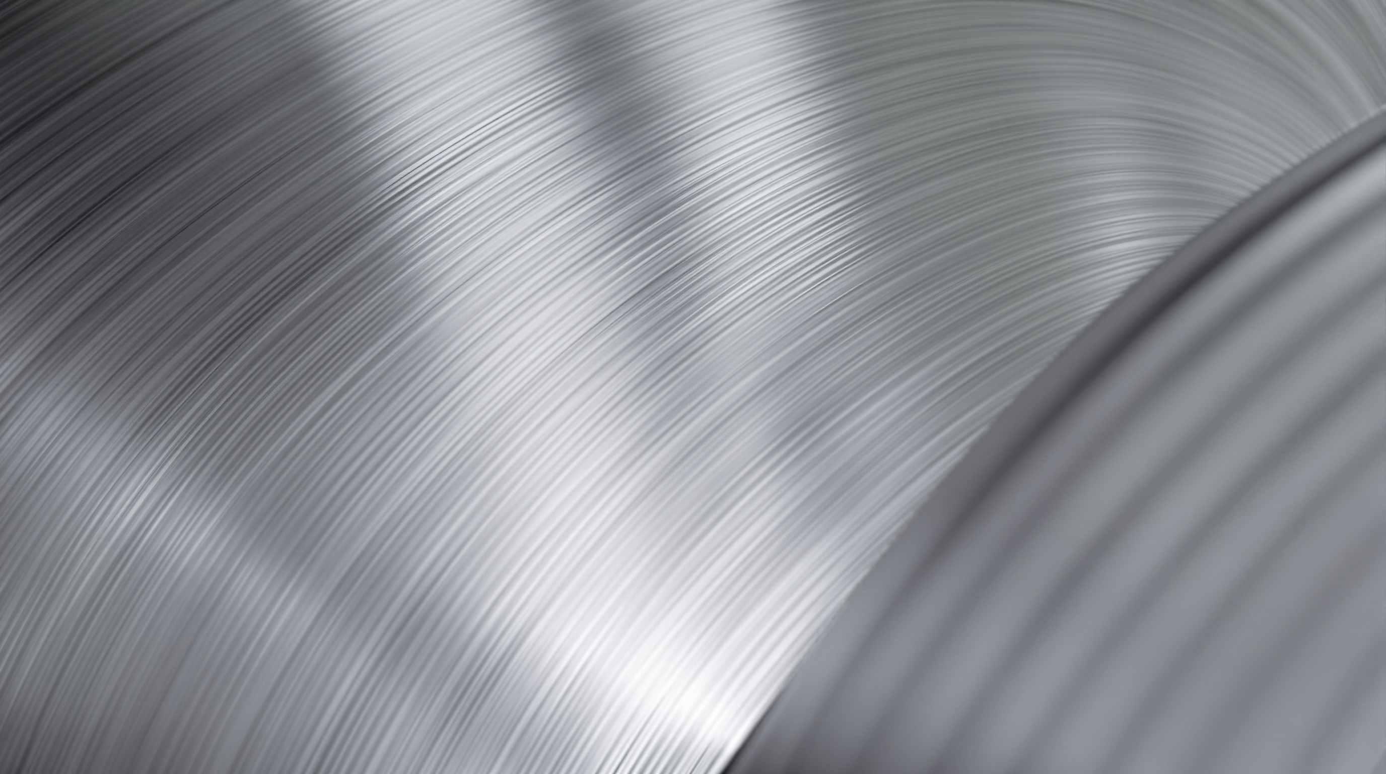 Close-up of galvanized steel coil edge showing metallic zinc coating